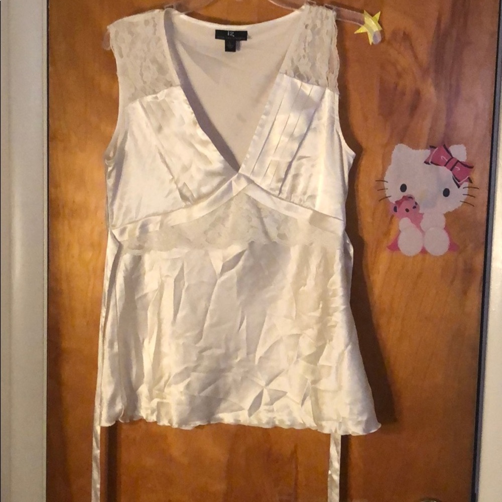 White satiny top